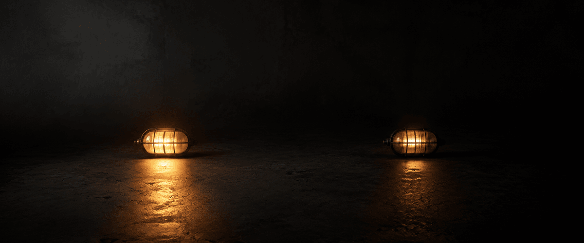 Two similar caged lamps glowing in a dark space, one closer and burning brighter, the other set farther back and dimmer, representing how content freshness affects AI trust over time