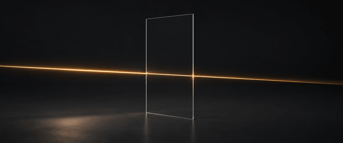 Clear glass allowing warm light to pass through unobstructed, representing pricing with nothing hidden