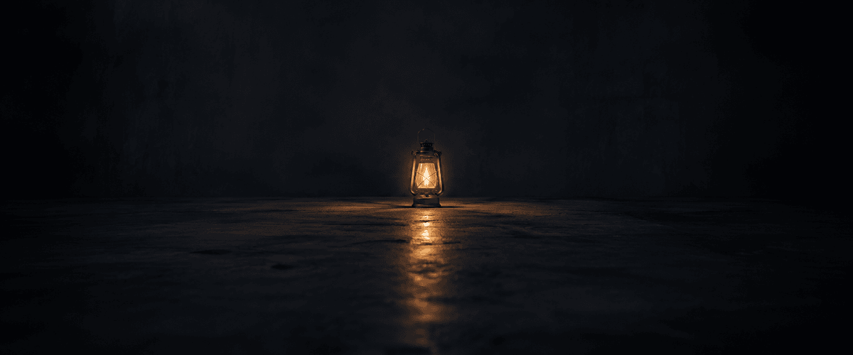 A single lantern casting a warm glow into a wide, empty dark space, with nothing else in view to judge it against — echoing how little context a first-time website visitor has to lean on