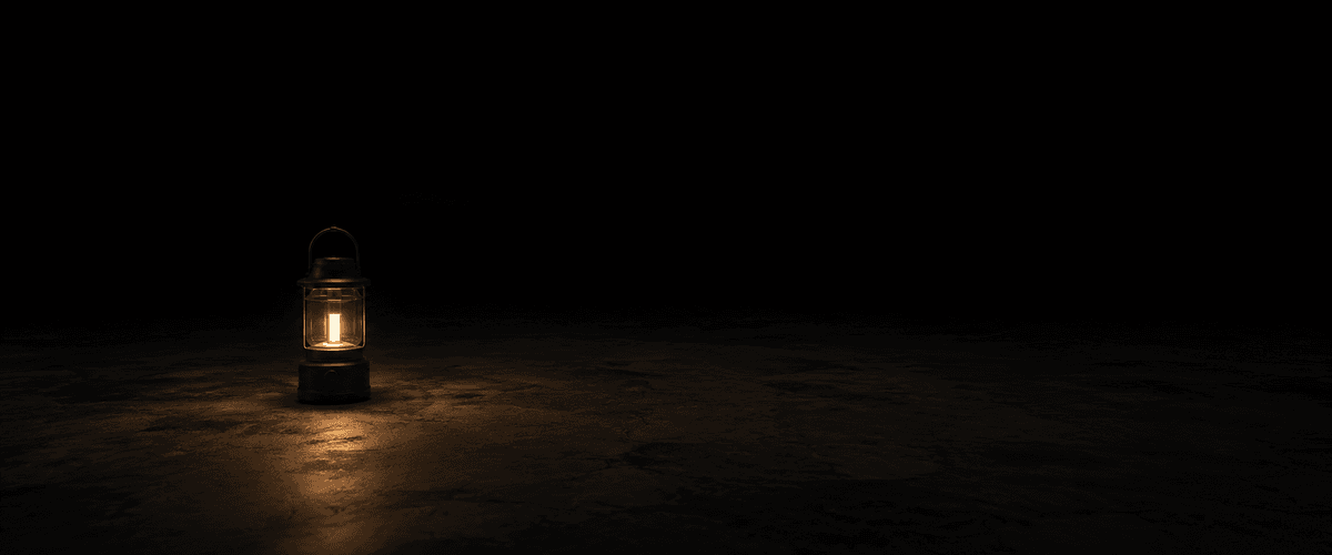 A single lit lantern standing alone in a vast dark space, representing a deliberate yearly check that nothing else prompts you to make