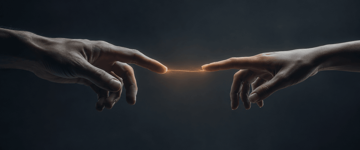 A handshake illuminated by warm light, representing the trust decision behind choosing who builds your business's website