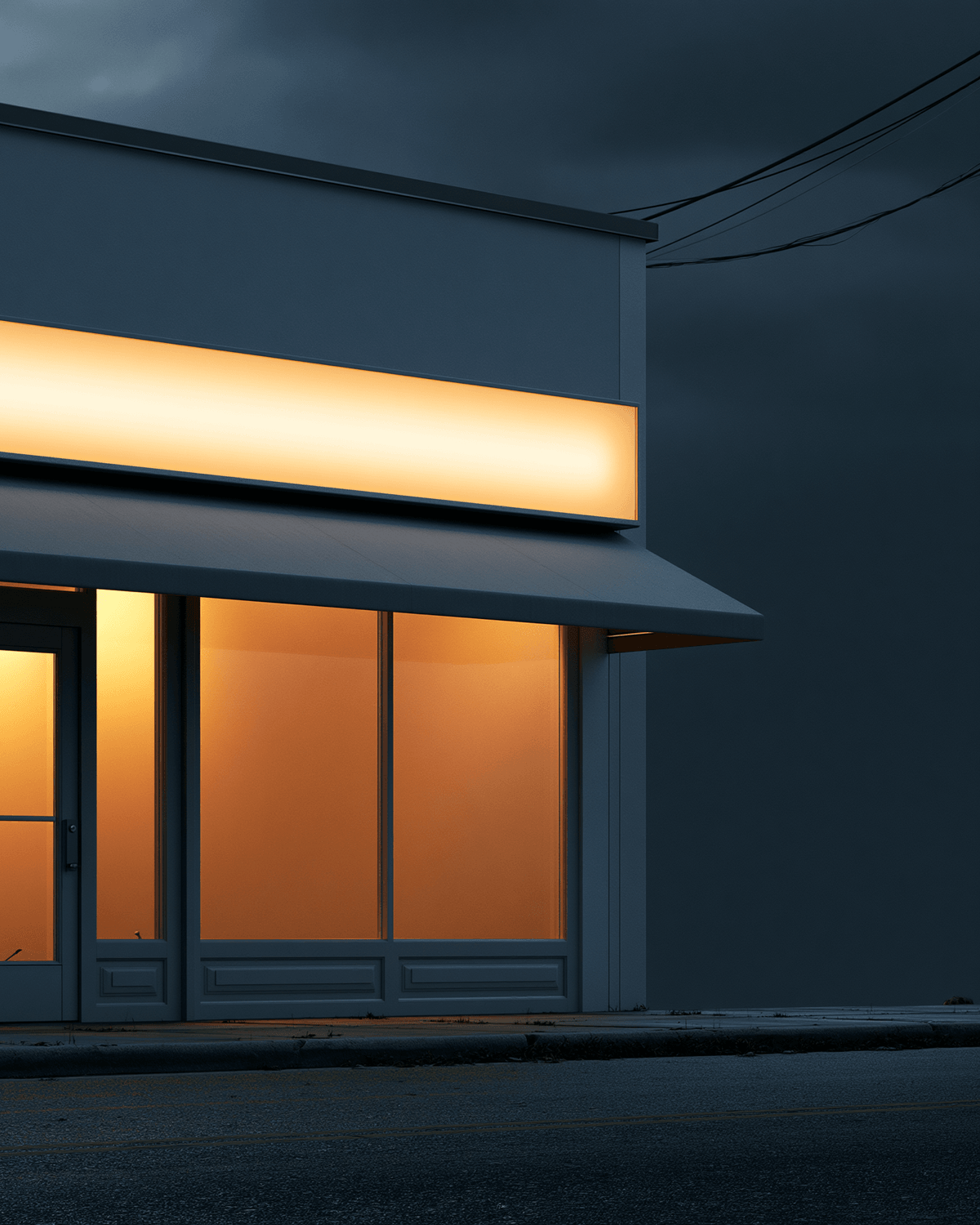 Storefront exterior with illuminated signage at night